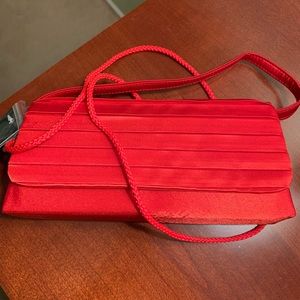 Red satin evening bag. Never used, tags still on.